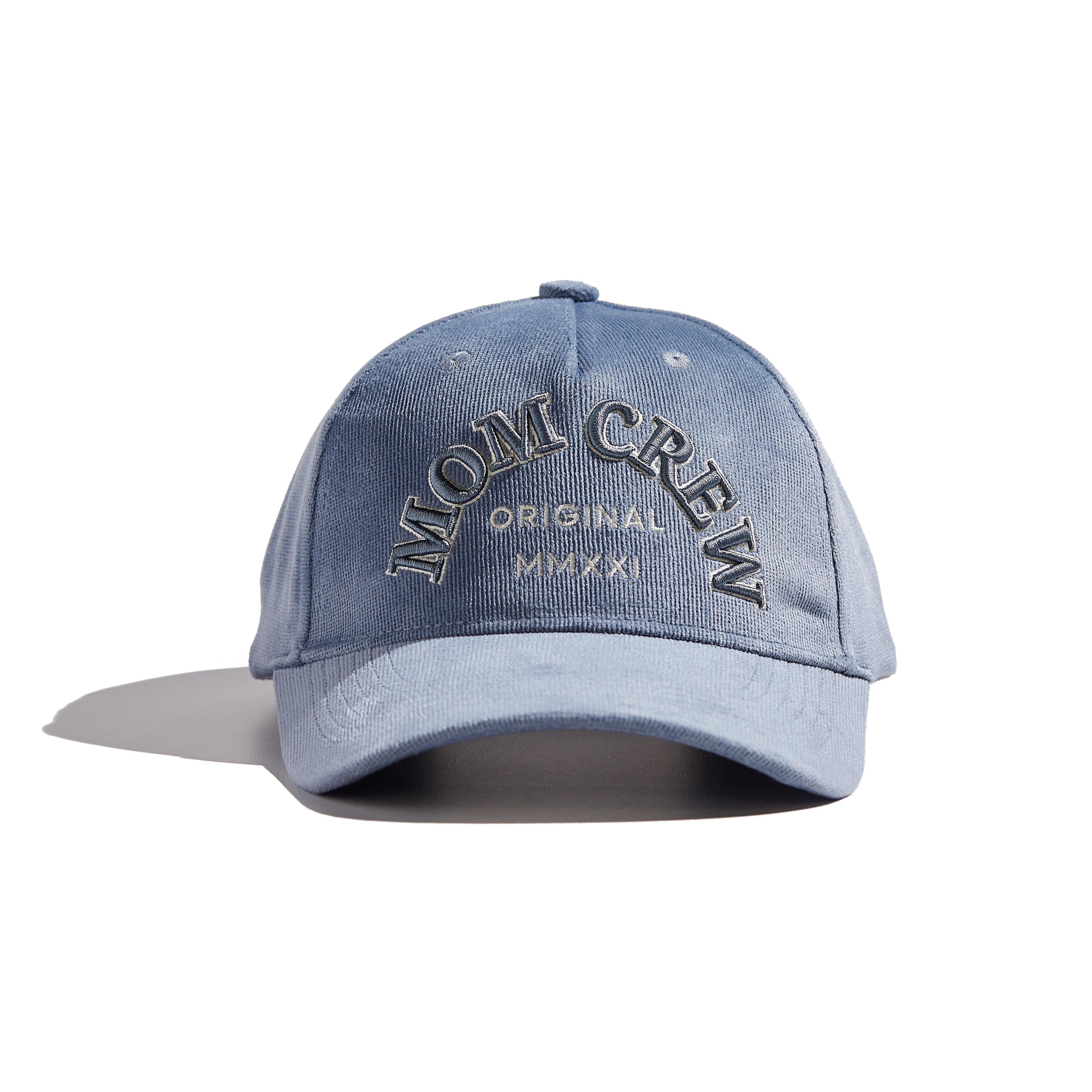 The MomCrew Classic Corduroy Cap is crafted from 100% cotton corduroy, offering a soft and comfortable fit. Featuring the signature MomCrew embroidered logo, it has an adjustable snap closure to accommodate various head sizes, making it suitable for both moms and dads. This stylish cap combines comfort and durability, perfect for everyday wear.