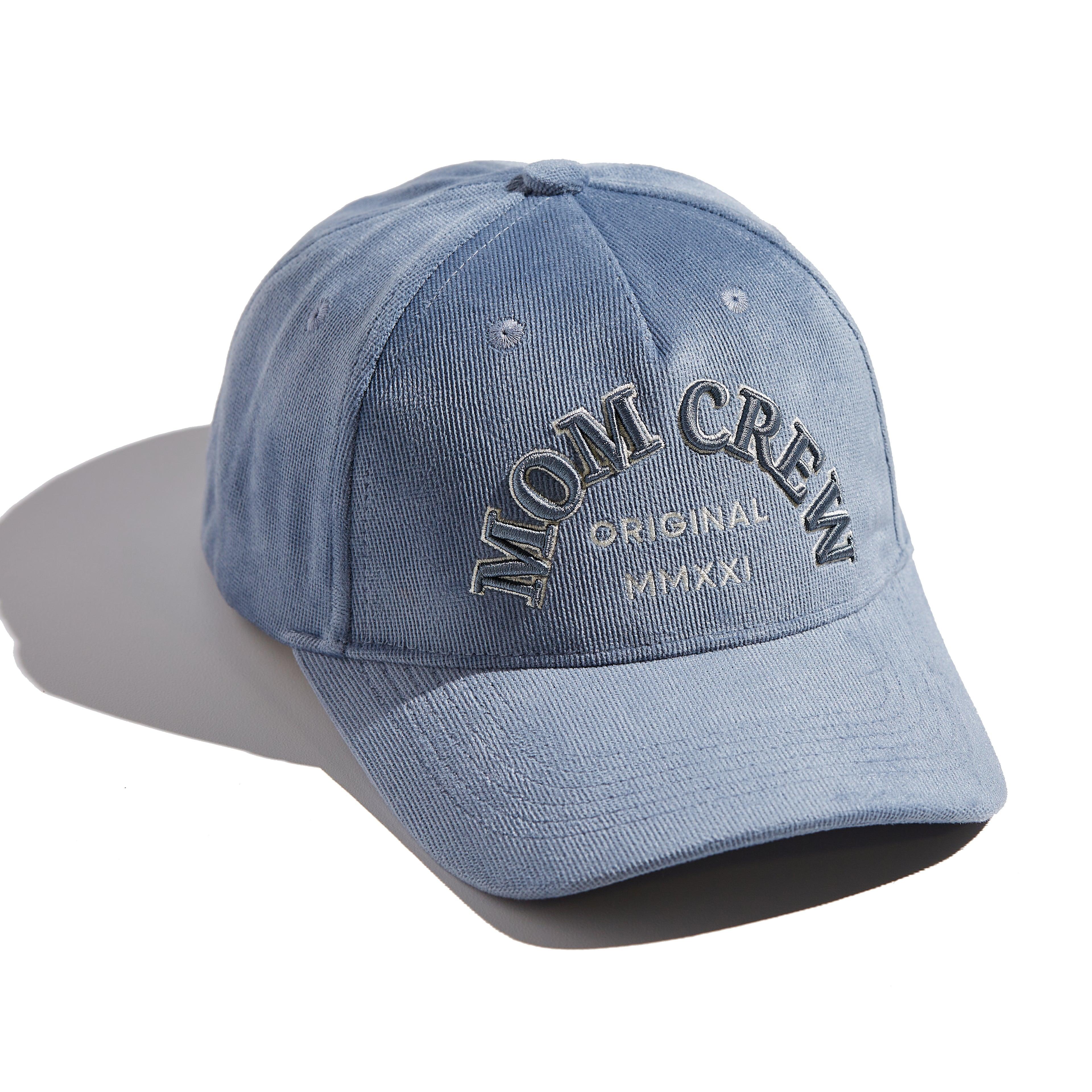 The MomCrew Classic Corduroy Cap is crafted from 100% cotton corduroy, offering a soft and comfortable fit. Featuring the signature MomCrew embroidered logo, it has an adjustable snap closure to accommodate various head sizes, making it suitable for both moms and dads. This stylish cap combines comfort and durability, perfect for everyday wear.