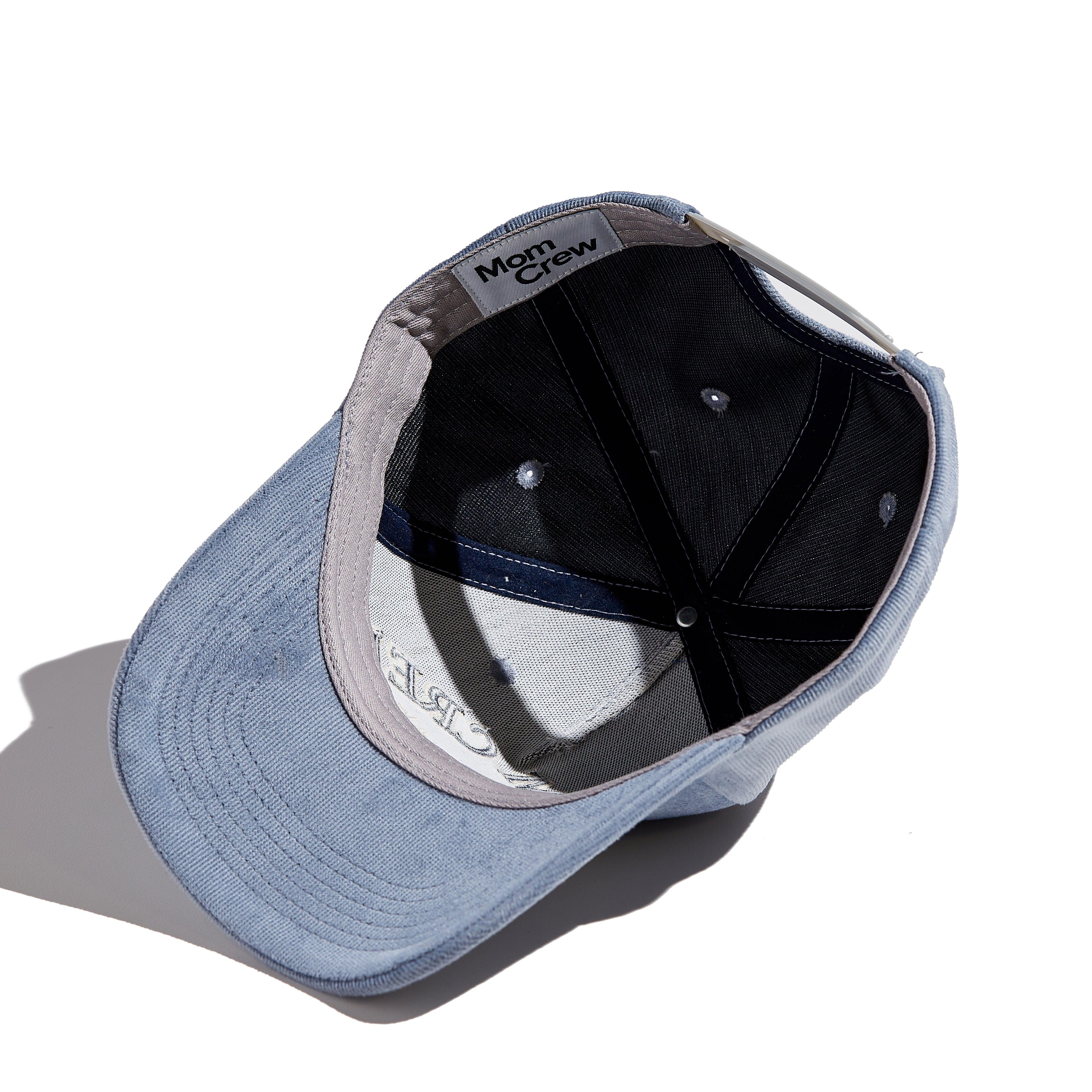 The MomCrew Classic Corduroy Cap is crafted from 100% cotton corduroy, offering a soft and comfortable fit. Featuring the signature MomCrew embroidered logo, it has an adjustable snap closure to accommodate various head sizes, making it suitable for both moms and dads. This stylish cap combines comfort and durability, perfect for everyday wear.