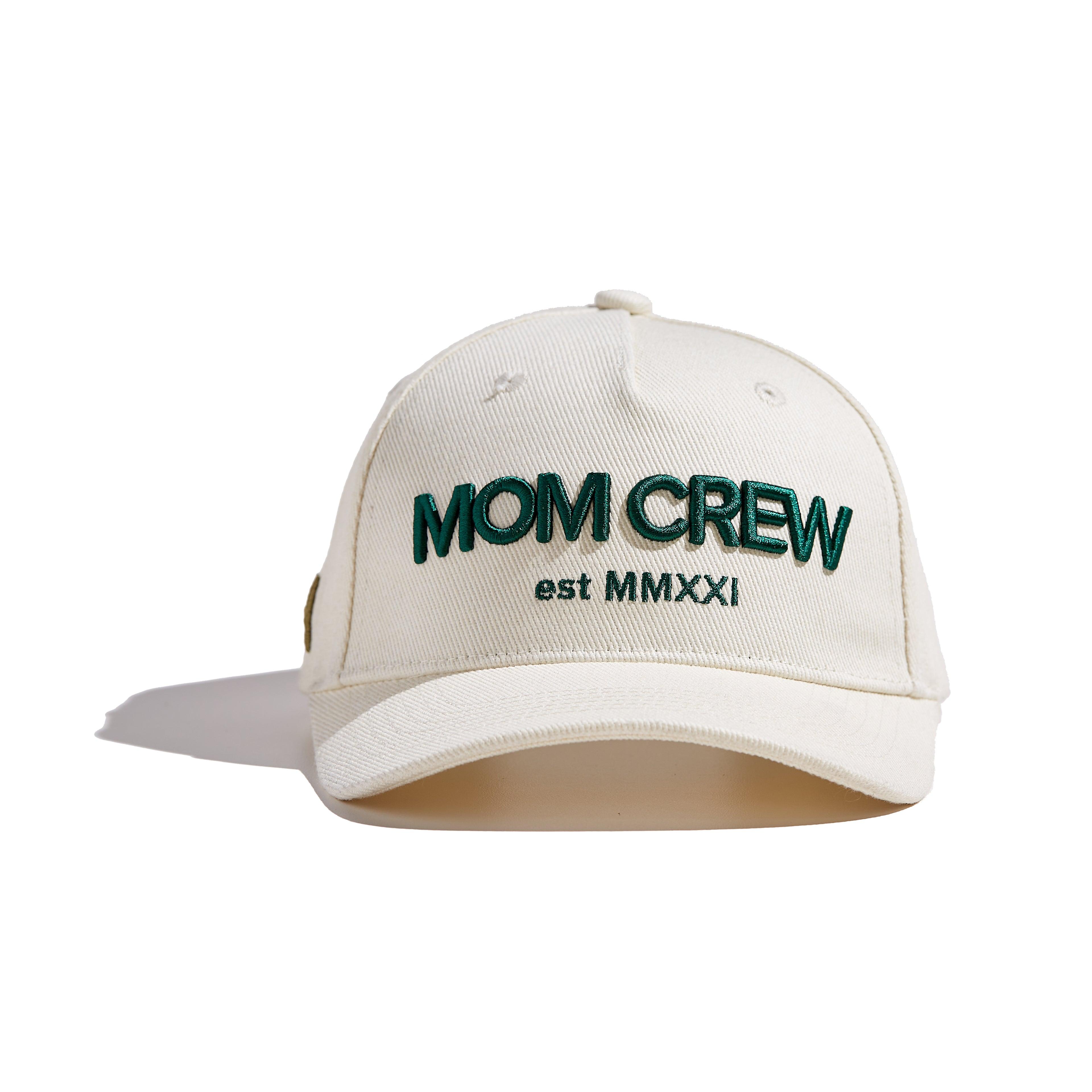 The MomCrew Essential Cotton Cap is a versatile and stylish accessory made from 100% cotton. It features the signature green MomCrew embroidered logo on the front and an adjustable snap closure for a custom fit, making it suitable for both moms and dads. This cap is perfect for everyday wear, combining comfort and durability, and is designed to fit most head sizes.