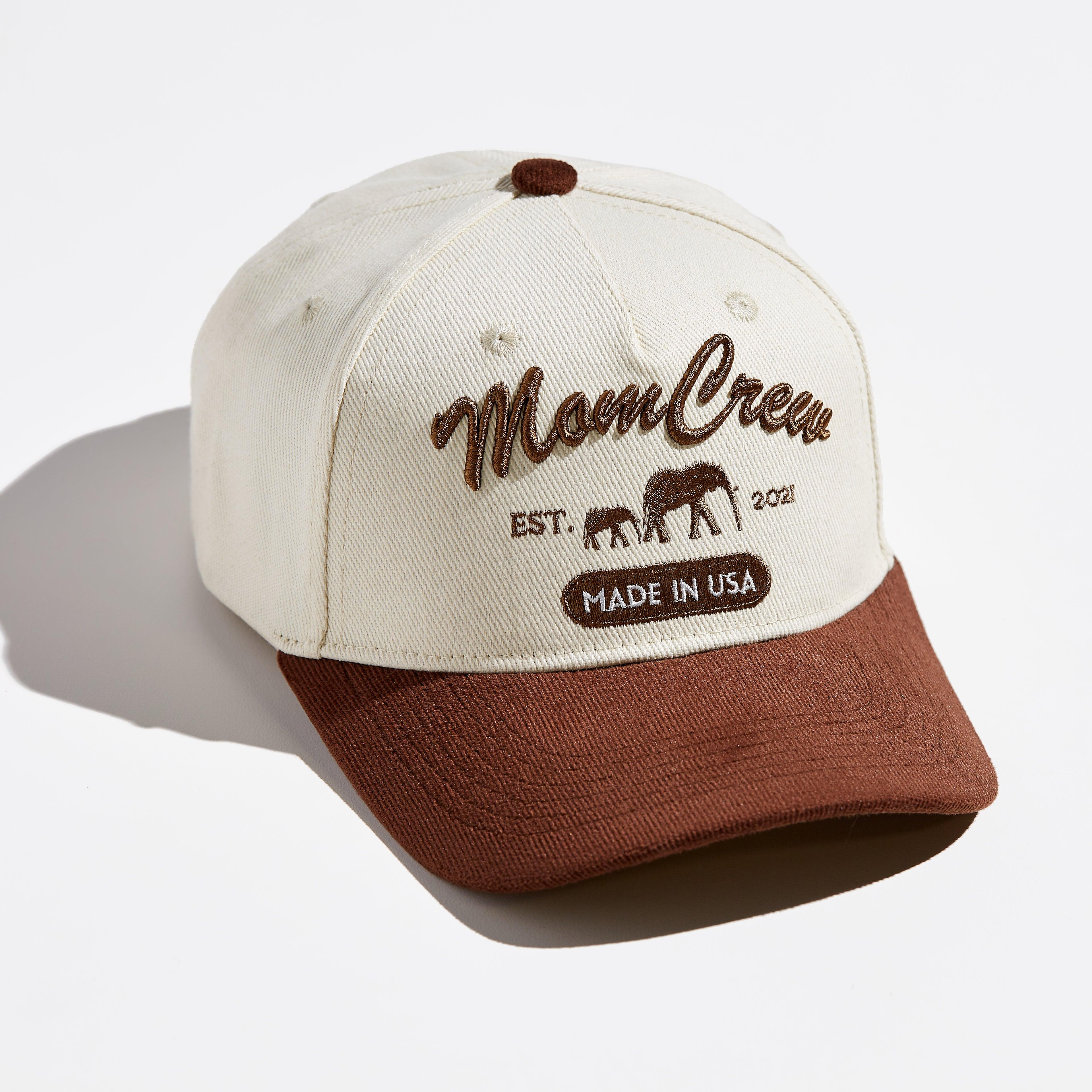 The MomCrew Rancher Cap is a stylish cap crafted from a blend of 100% cotton and corduroy, featuring the iconic MomCrew embroidered logo. It's designed with an adjustable snap closure, making it a comfortable and customizable fit for both moms and dads. Ideal for those who appreciate a western-inspired look with a modern twist, this cap blends durability with style, making it perfect for everyday wear.