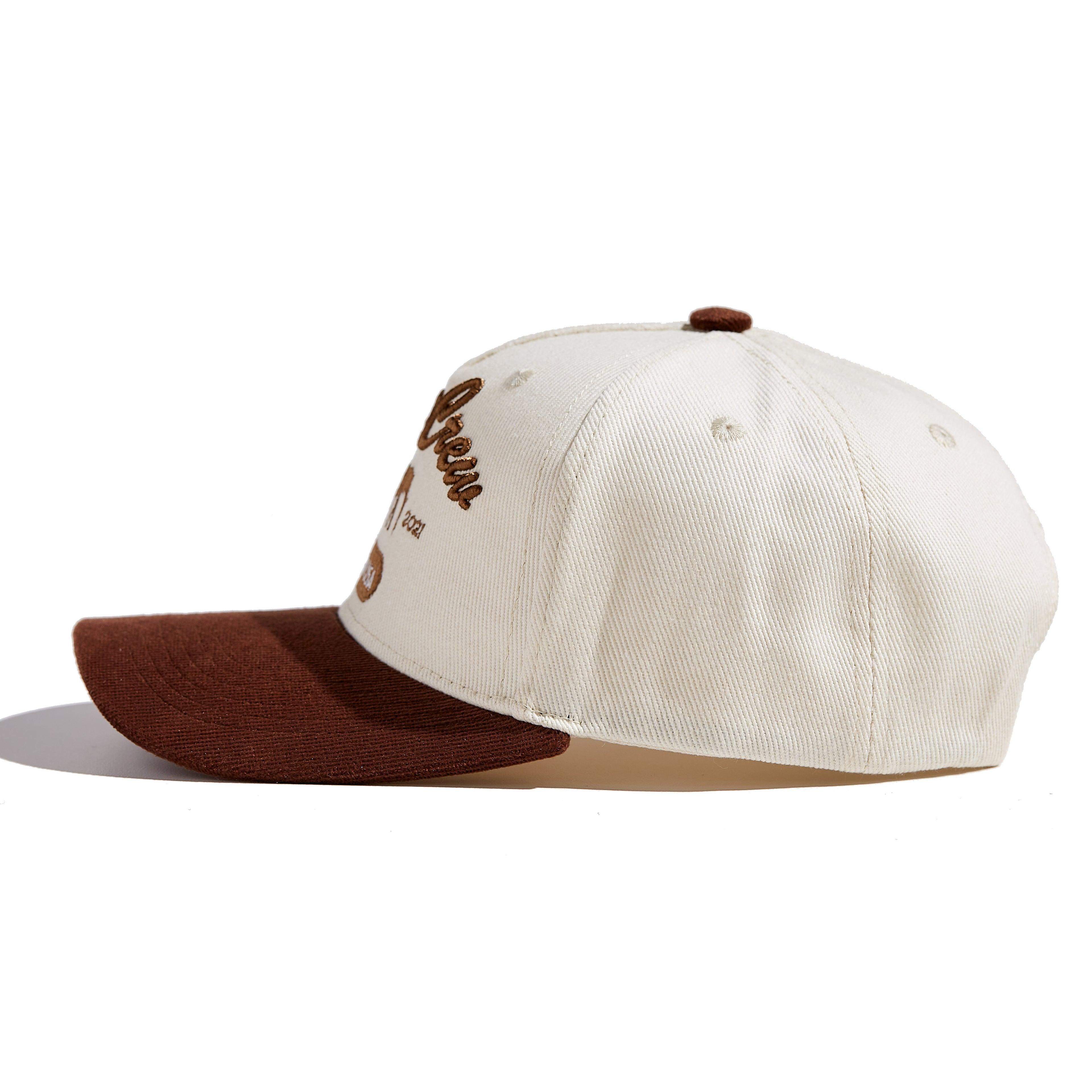The MomCrew Rancher Cap is a stylish cap crafted from a blend of 100% cotton and corduroy, featuring the iconic MomCrew embroidered logo. It's designed with an adjustable snap closure, making it a comfortable and customizable fit for both moms and dads. Ideal for those who appreciate a western-inspired look with a modern twist, this cap blends durability with style, making it perfect for everyday wear.