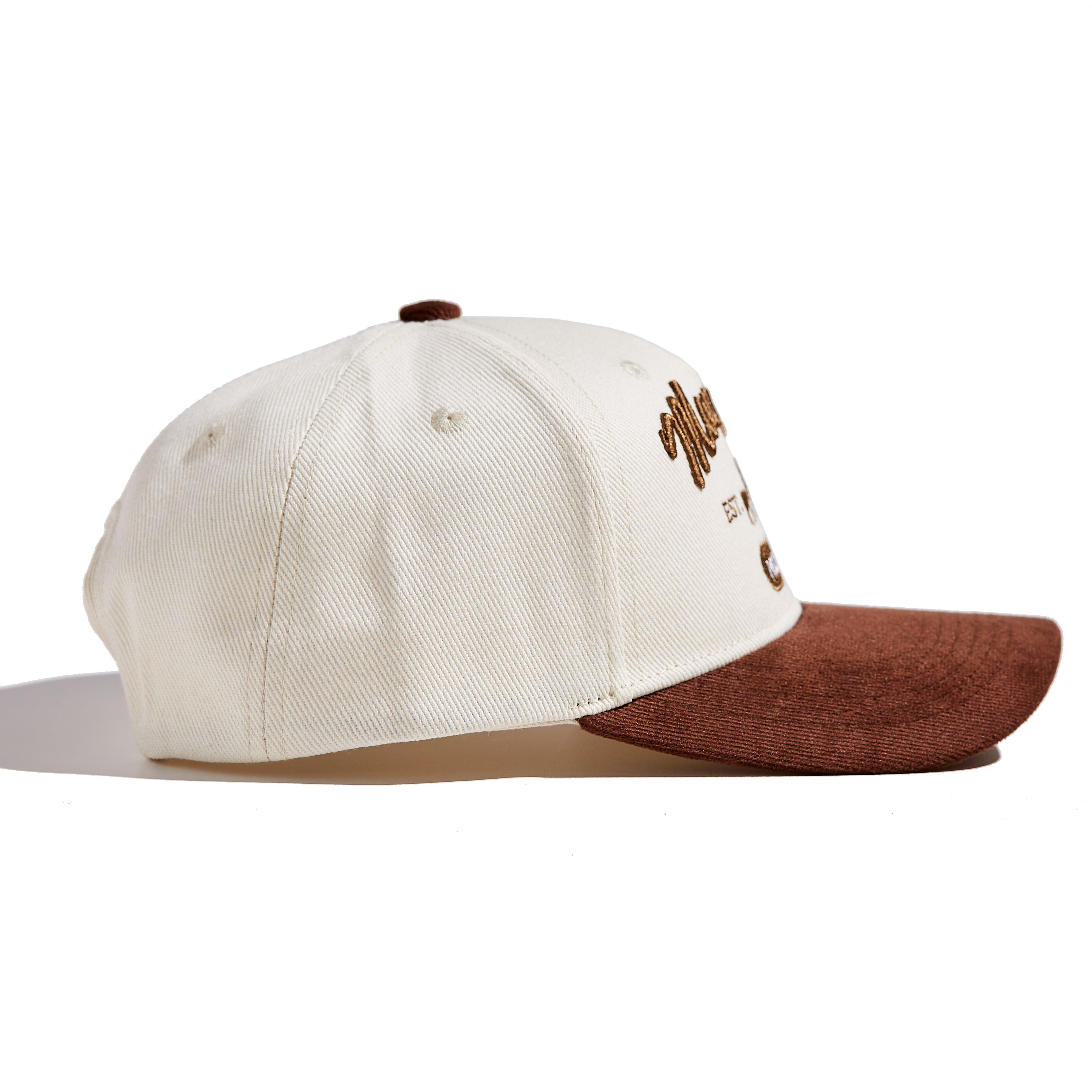 The MomCrew Rancher Cap is a stylish cap crafted from a blend of 100% cotton and corduroy, featuring the iconic MomCrew embroidered logo. It's designed with an adjustable snap closure, making it a comfortable and customizable fit for both moms and dads. Ideal for those who appreciate a western-inspired look with a modern twist, this cap blends durability with style, making it perfect for everyday wear.