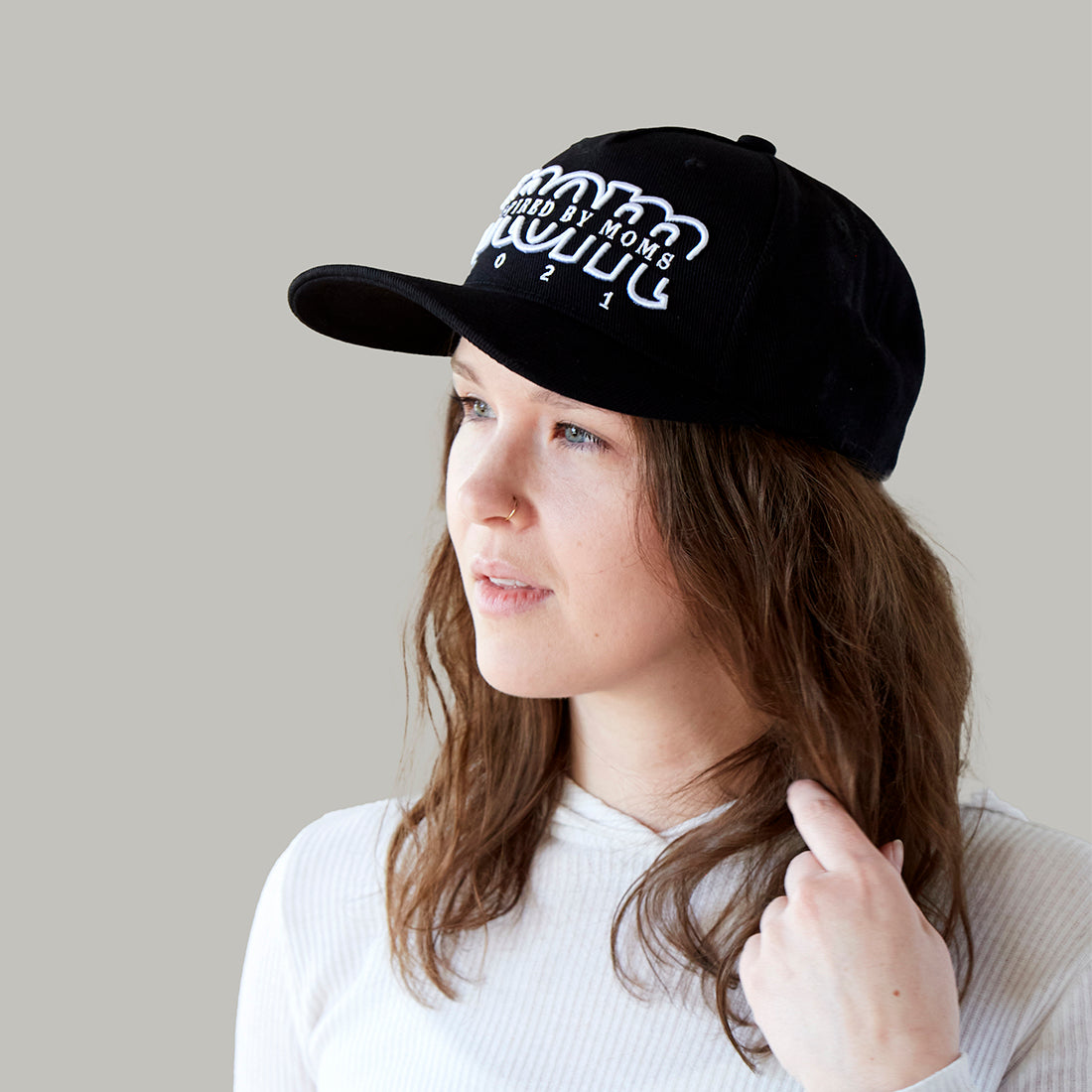 The MomCrew Statement Cotton Cap is a sleek and versatile accessory made from 100% cotton. It features the signature MomCrew logo embroidered on the front and comes with an adjustable snap closure to ensure a perfect fit for both moms and dads. This cap combines comfort and style, making it ideal for daily wear and supporting the MomCrew community in every outfit. Designed to fit most head sizes, it’s perfect for those who want to make a stylish statement while celebrating motherhood.