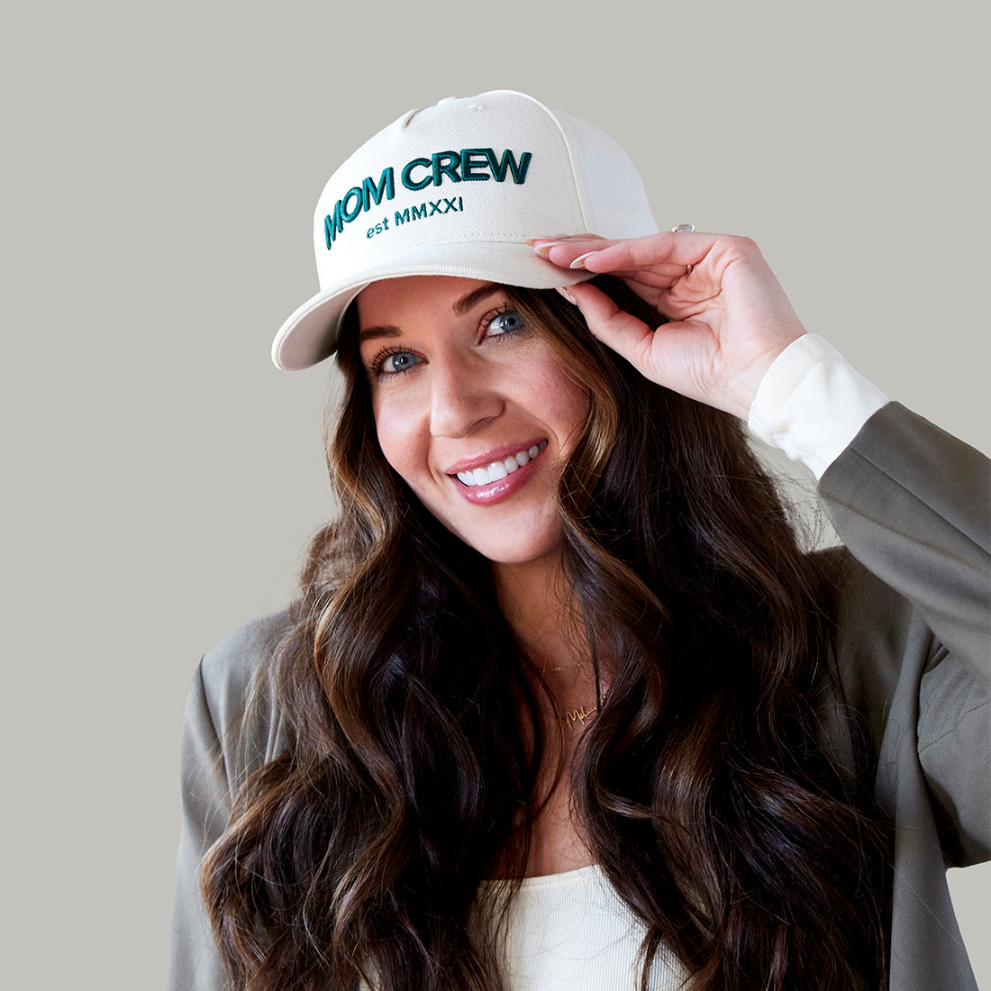 The MomCrew Essential Cotton Cap is a versatile and stylish accessory made from 100% cotton. It features the signature green MomCrew embroidered logo on the front and an adjustable snap closure for a custom fit, making it suitable for both moms and dads. This cap is perfect for everyday wear, combining comfort and durability, and is designed to fit most head sizes.