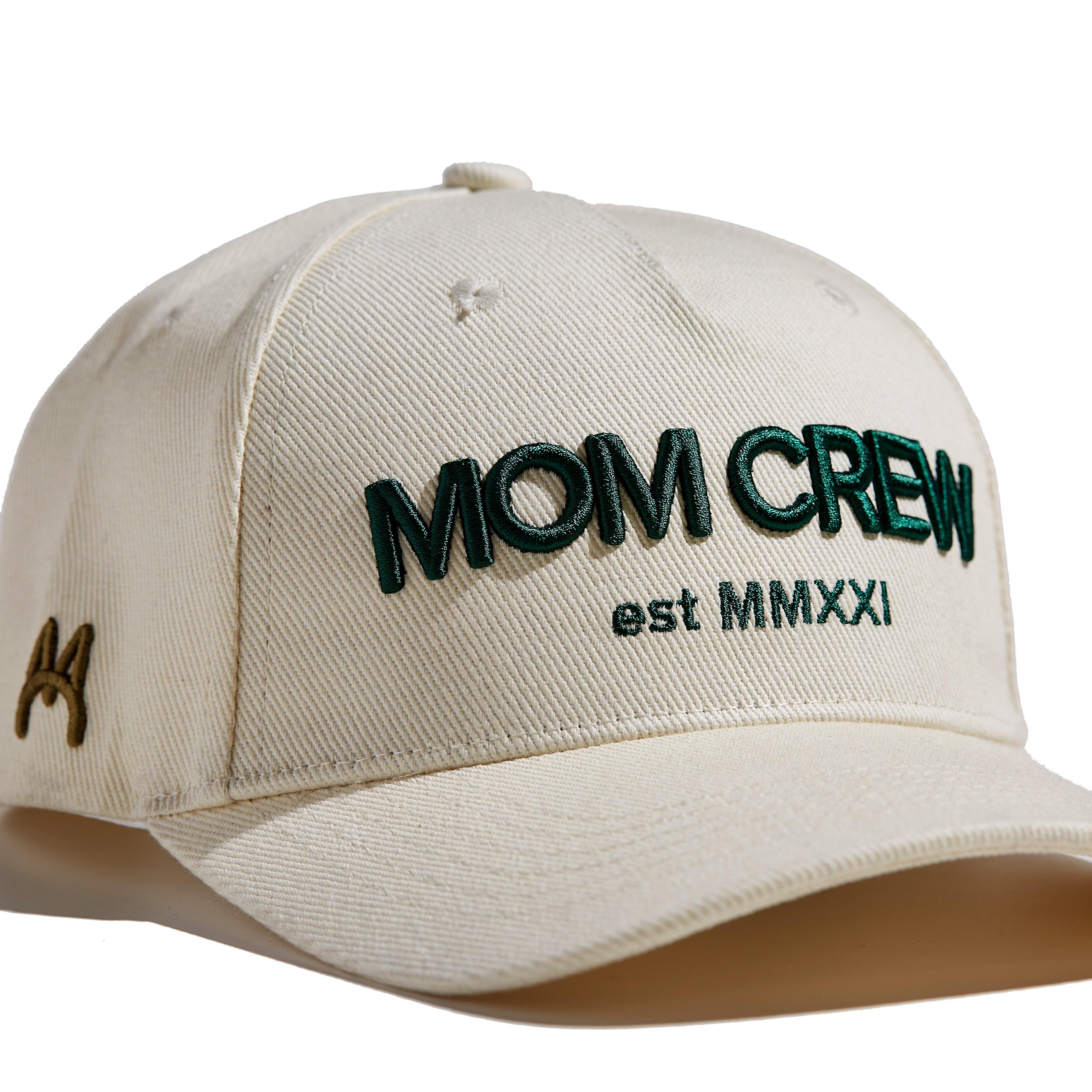 The MomCrew Essential Cotton Cap is a versatile and stylish accessory made from 100% cotton. It features the signature green MomCrew embroidered logo on the front and an adjustable snap closure for a custom fit, making it suitable for both moms and dads. This cap is perfect for everyday wear, combining comfort and durability, and is designed to fit most head sizes.