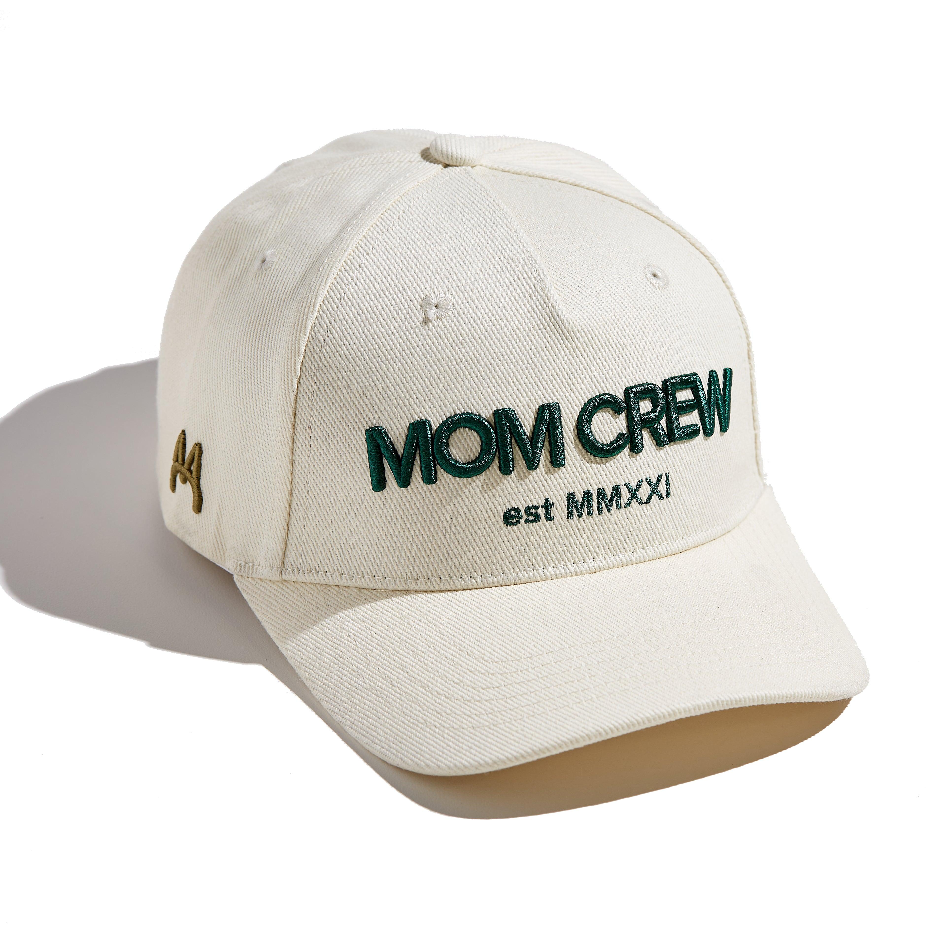 The MomCrew Essential Cotton Cap is a versatile and stylish accessory made from 100% cotton. It features the signature green MomCrew embroidered logo on the front and an adjustable snap closure for a custom fit, making it suitable for both moms and dads. This cap is perfect for everyday wear, combining comfort and durability, and is designed to fit most head sizes.