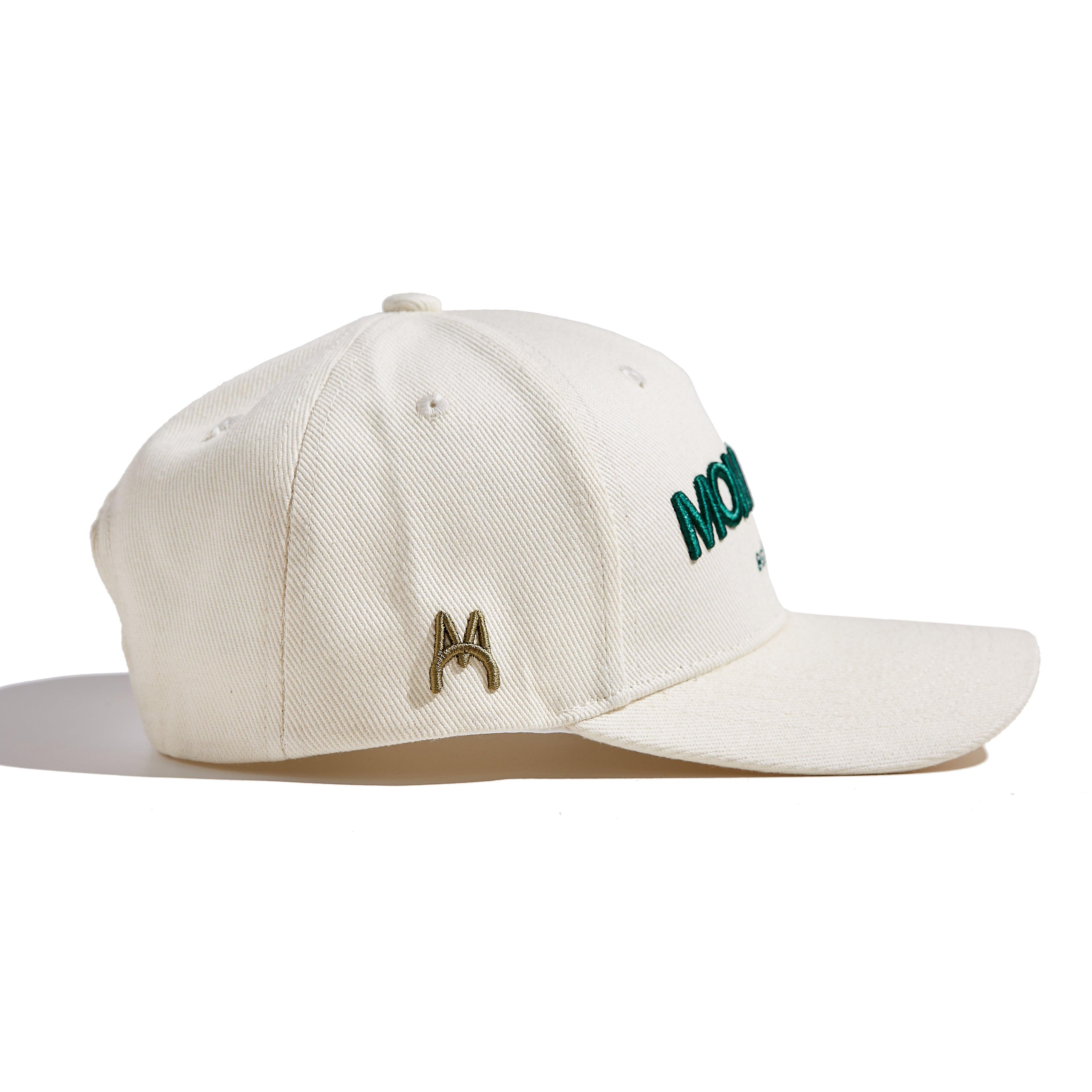 The MomCrew Essential Cotton Cap is a versatile and stylish accessory made from 100% cotton. It features the signature green MomCrew embroidered logo on the front and an adjustable snap closure for a custom fit, making it suitable for both moms and dads. This cap is perfect for everyday wear, combining comfort and durability, and is designed to fit most head sizes.