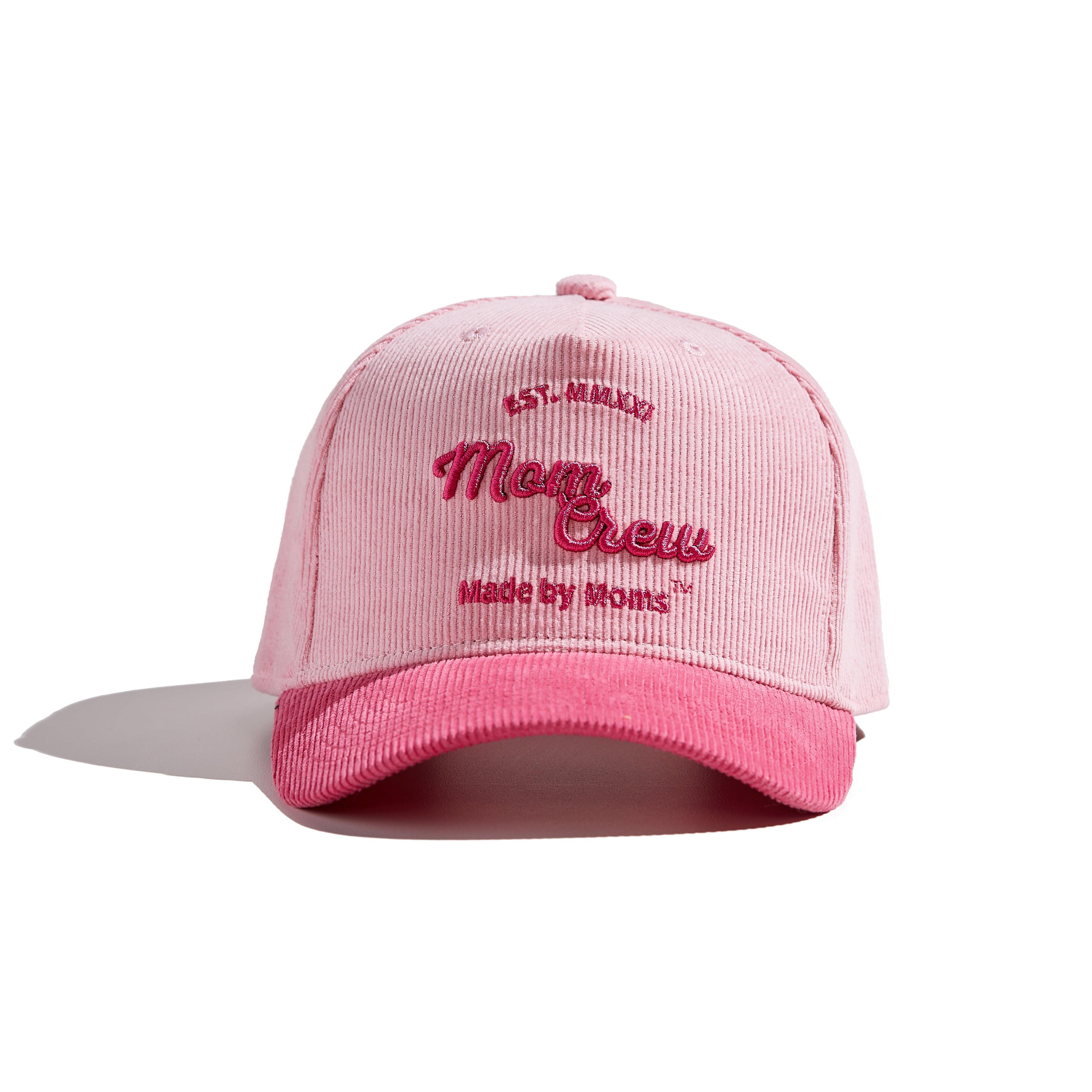 The MomCrew Pink Corduroy Cap is a stylish and versatile cap inspired by Barbie, designed with 100% cotton corduroy material for both the body and brim. It features the signature MomCrew logo embroidered in green and includes an adjustable snap closure to ensure a perfect fit for various head sizes, making it suitable for both moms and dads. This cap offers a chic, laid-back vibe, perfect for daily wear.