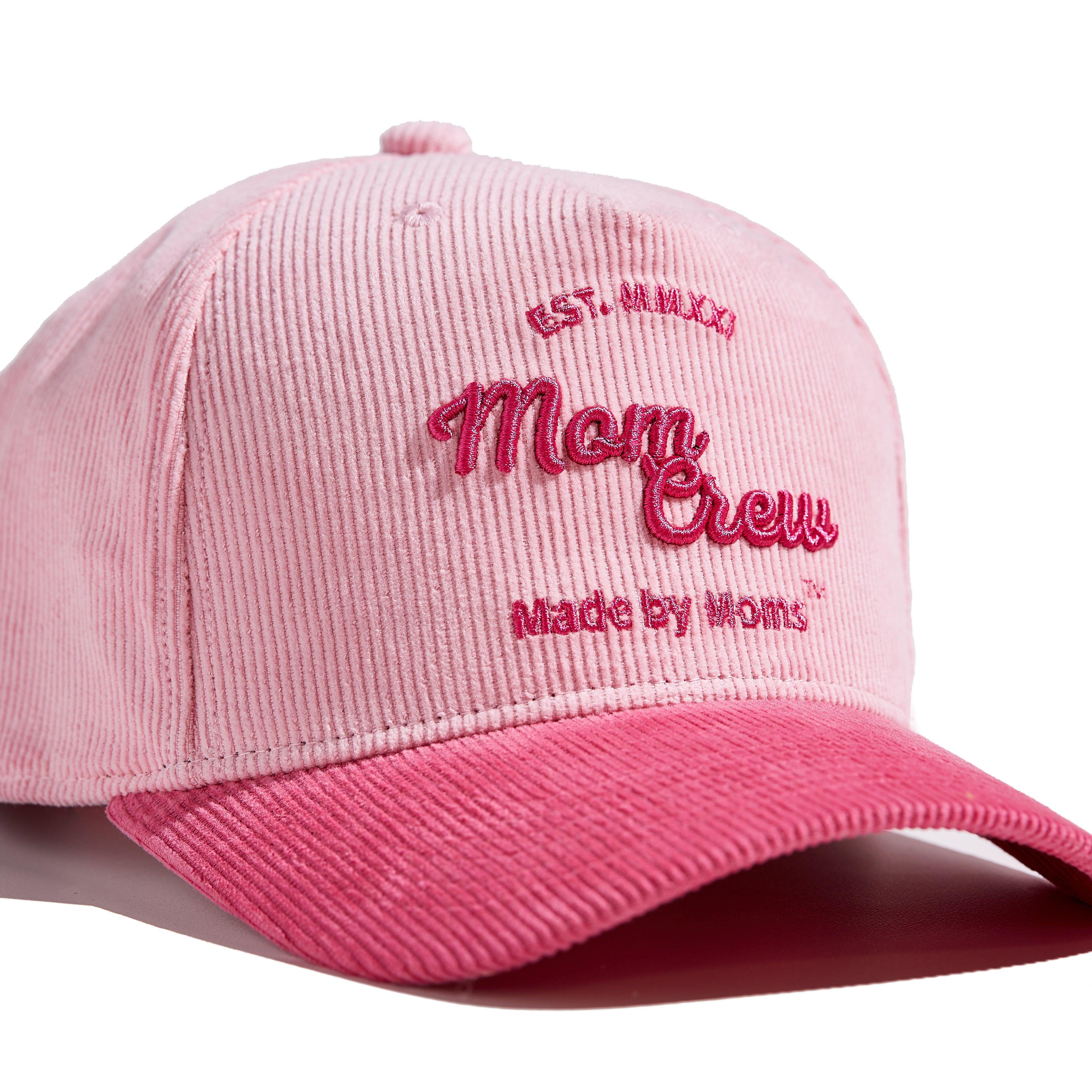 The MomCrew Pink Corduroy Cap is a stylish and versatile cap inspired by Barbie, designed with 100% cotton corduroy material for both the body and brim. It features the signature MomCrew logo embroidered in green and includes an adjustable snap closure to ensure a perfect fit for various head sizes, making it suitable for both moms and dads. This cap offers a chic, laid-back vibe, perfect for daily wear.