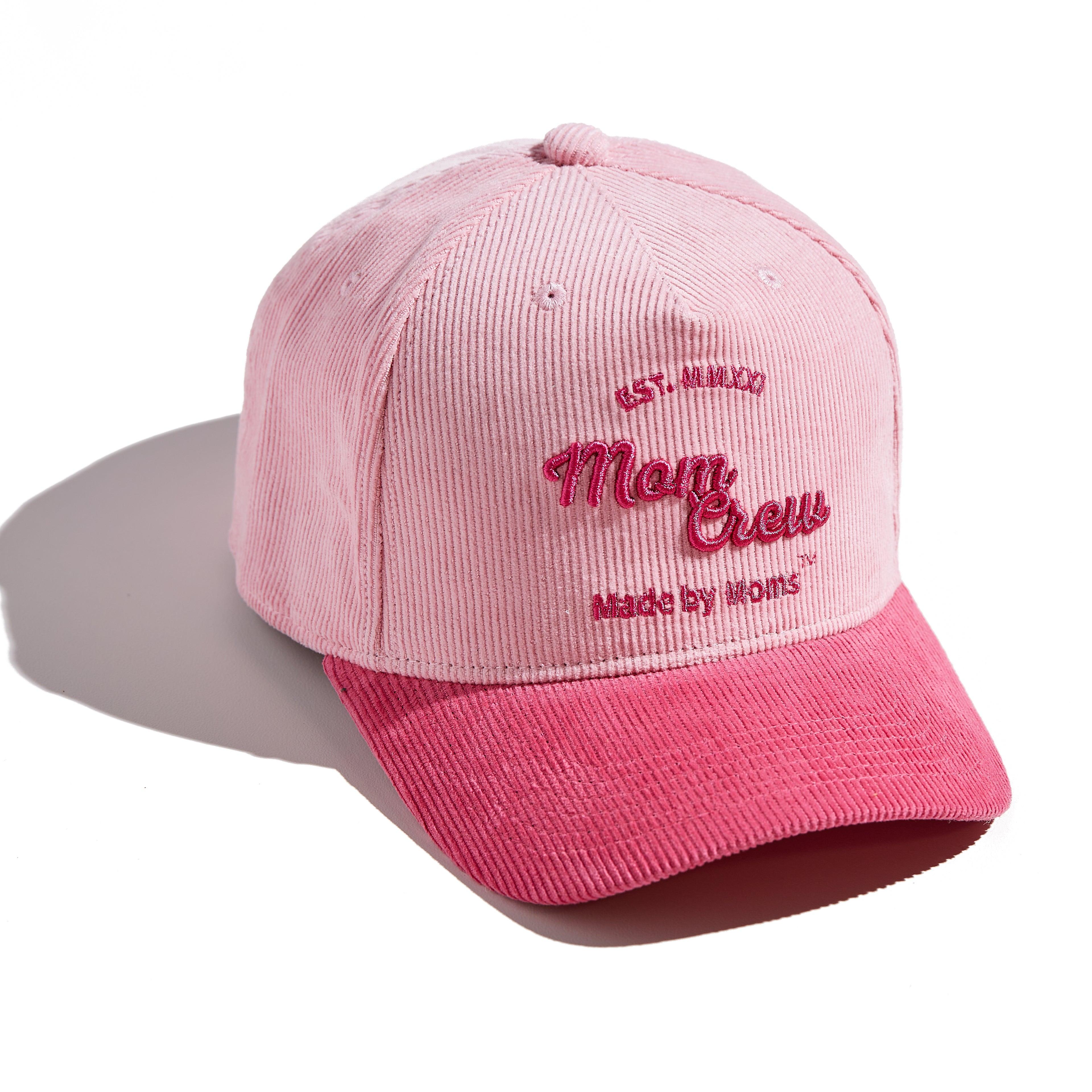 The MomCrew Pink Corduroy Cap is a stylish and versatile cap inspired by Barbie, designed with 100% cotton corduroy material for both the body and brim. It features the signature MomCrew logo embroidered in green and includes an adjustable snap closure to ensure a perfect fit for various head sizes, making it suitable for both moms and dads. This cap offers a chic, laid-back vibe, perfect for daily wear.