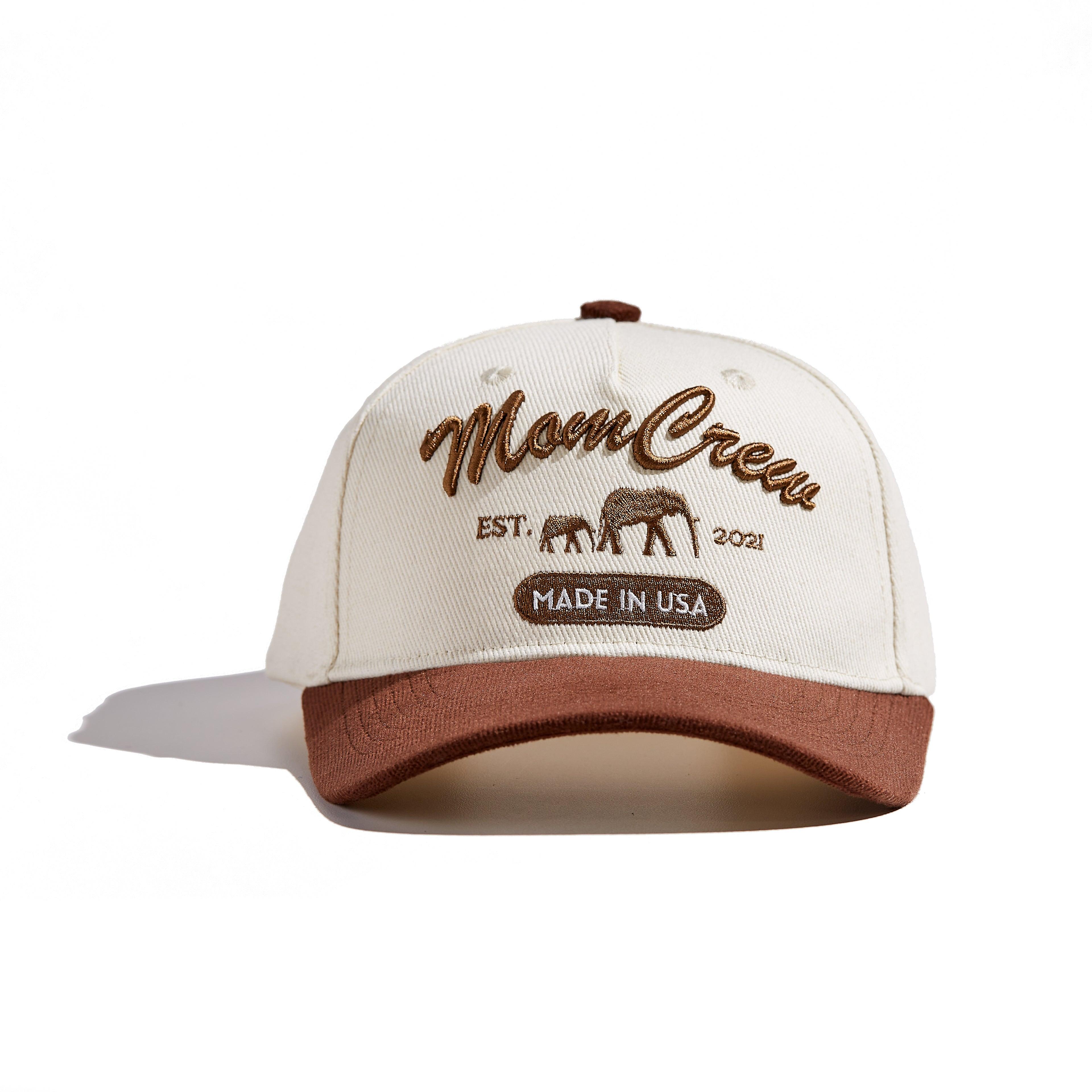 The MomCrew Rancher Cap is a stylish cap crafted from a blend of 100% cotton and corduroy, featuring the iconic MomCrew embroidered logo. It's designed with an adjustable snap closure, making it a comfortable and customizable fit for both moms and dads. Ideal for those who appreciate a western-inspired look with a modern twist, this cap blends durability with style, making it perfect for everyday wear.