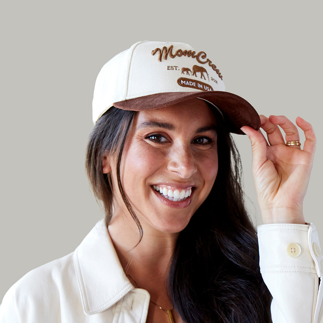 The MomCrew Rancher Cap is a stylish cap crafted from a blend of 100% cotton and corduroy, featuring the iconic MomCrew embroidered logo. It's designed with an adjustable snap closure, making it a comfortable and customizable fit for both moms and dads. Ideal for those who appreciate a western-inspired look with a modern twist, this cap blends durability with style, making it perfect for everyday wear.